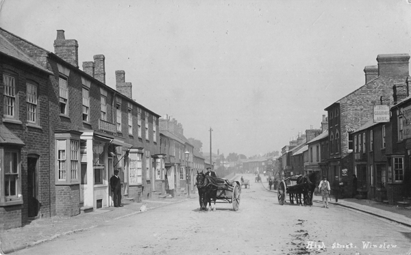 High Street looking north, two horses and carts in the road