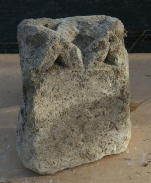 Carved stone with dog-tooth moulding